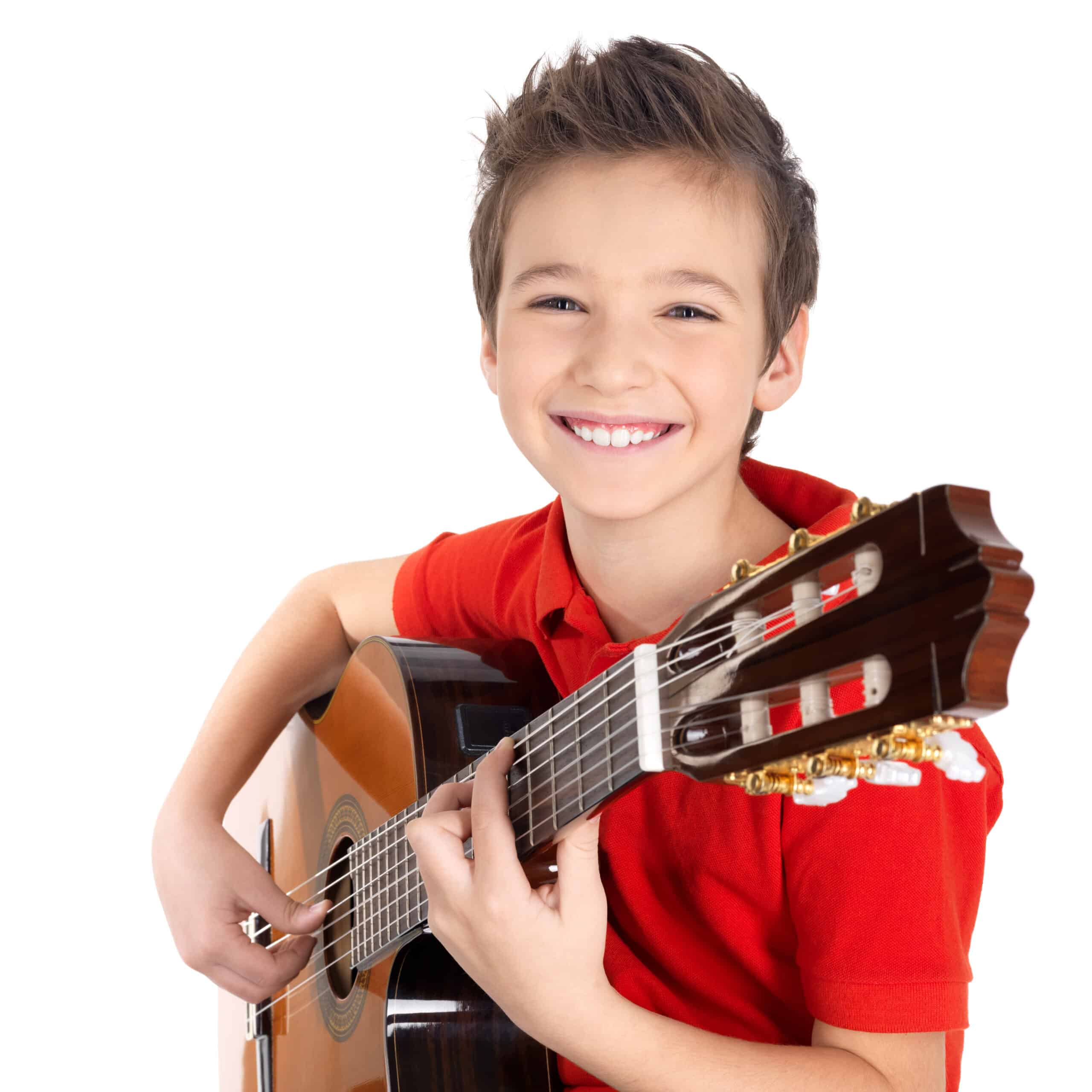 Young student learning acoustic guitar